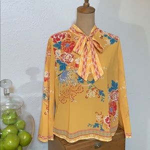 Yellow floral long sleeved blouse.